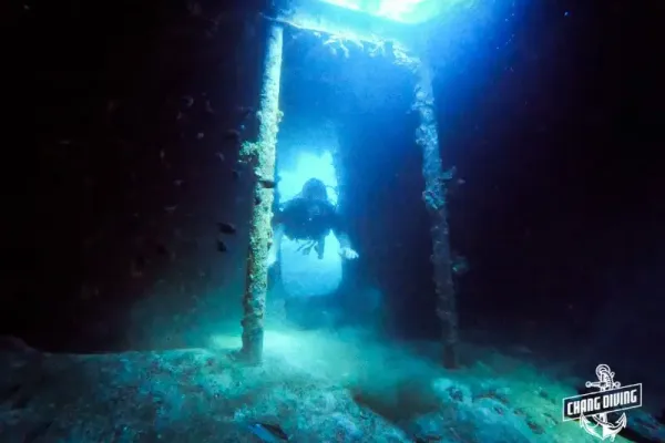 Diver exploring the T11 wreck at Koh Chang