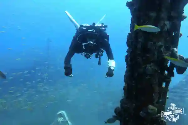 Technical diver with sidemount configuration practicing buoyancy control during TDI Intro to Tech course