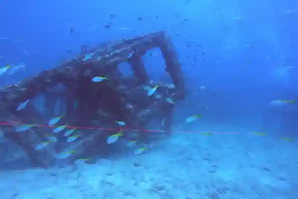 Scuba diver performing square pattern navigation with compass